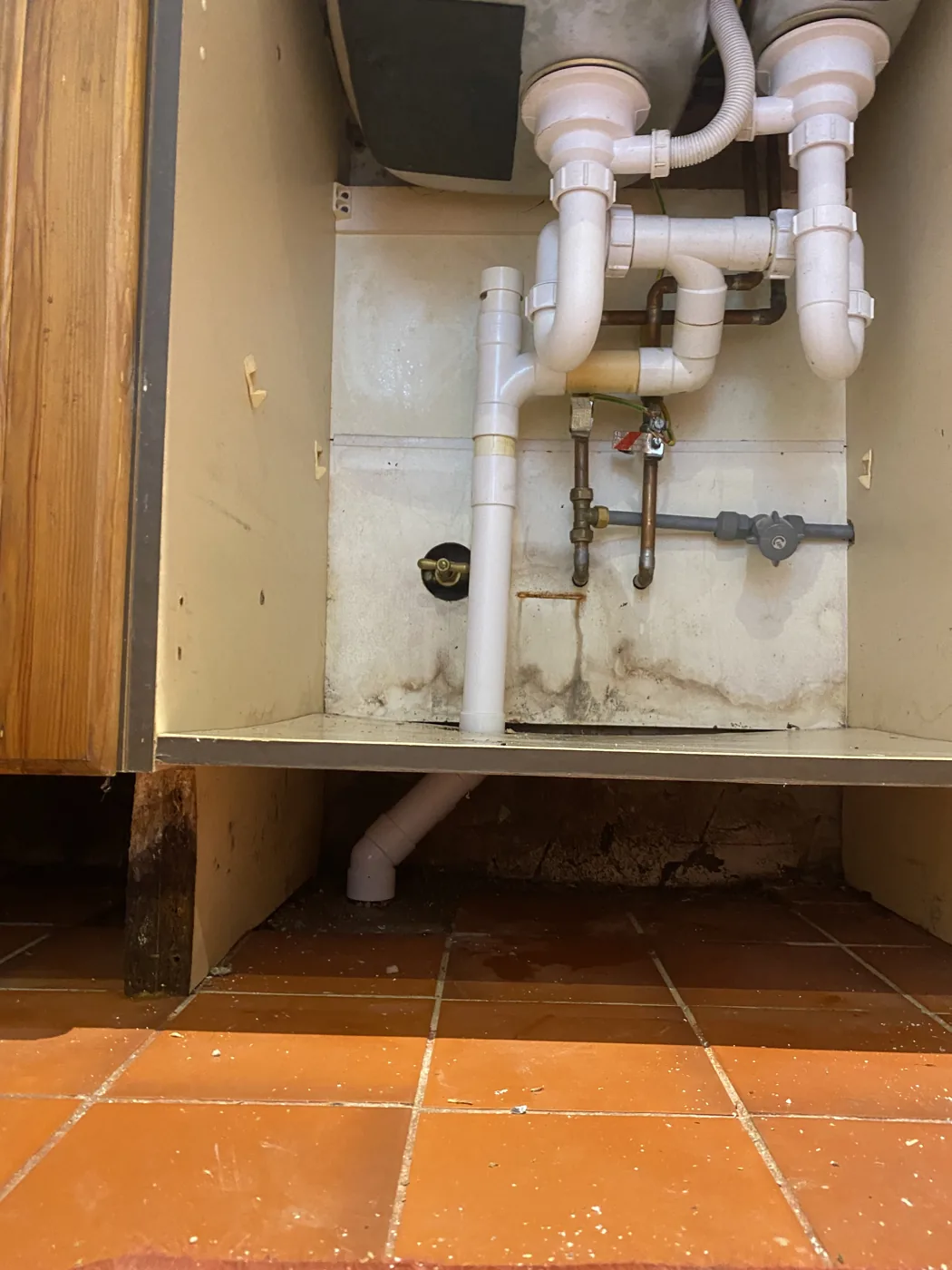 Completed under-sink waste pipework following a blockage and plumbing repair